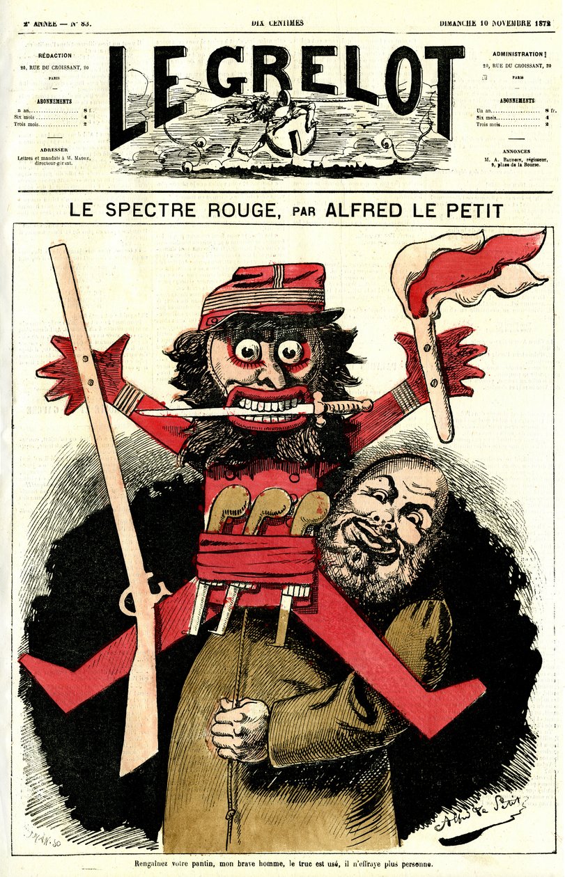 Ein katholischer Priester schwenkte eine kleine Figur von Alfred Le Petit