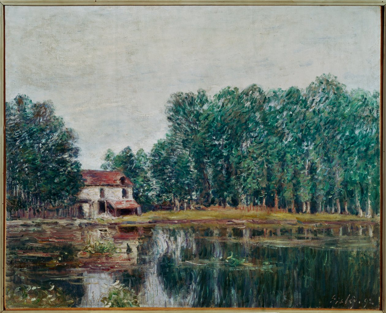 Das Ufer des Kanals in Moret-sur-Loing von Alfred Sisley
