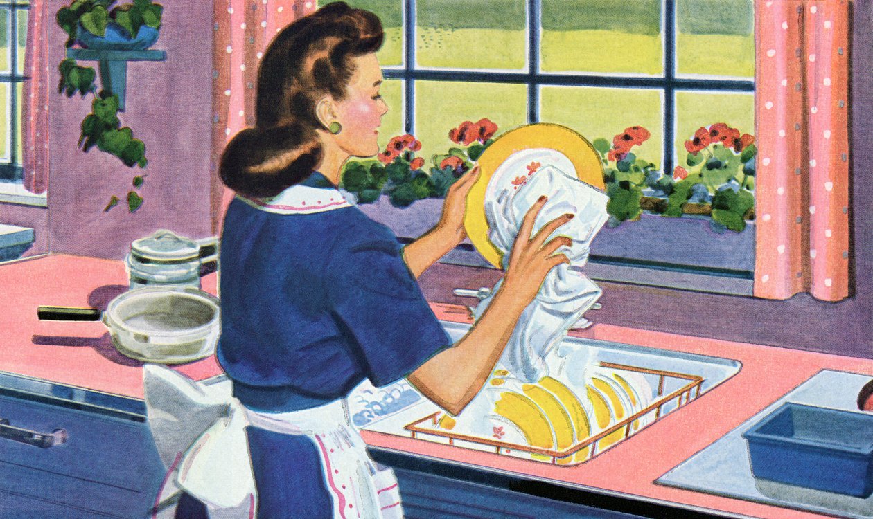 Hausfrau der 1940er Jahre spült Geschirr in ihrer Traumküche von American School