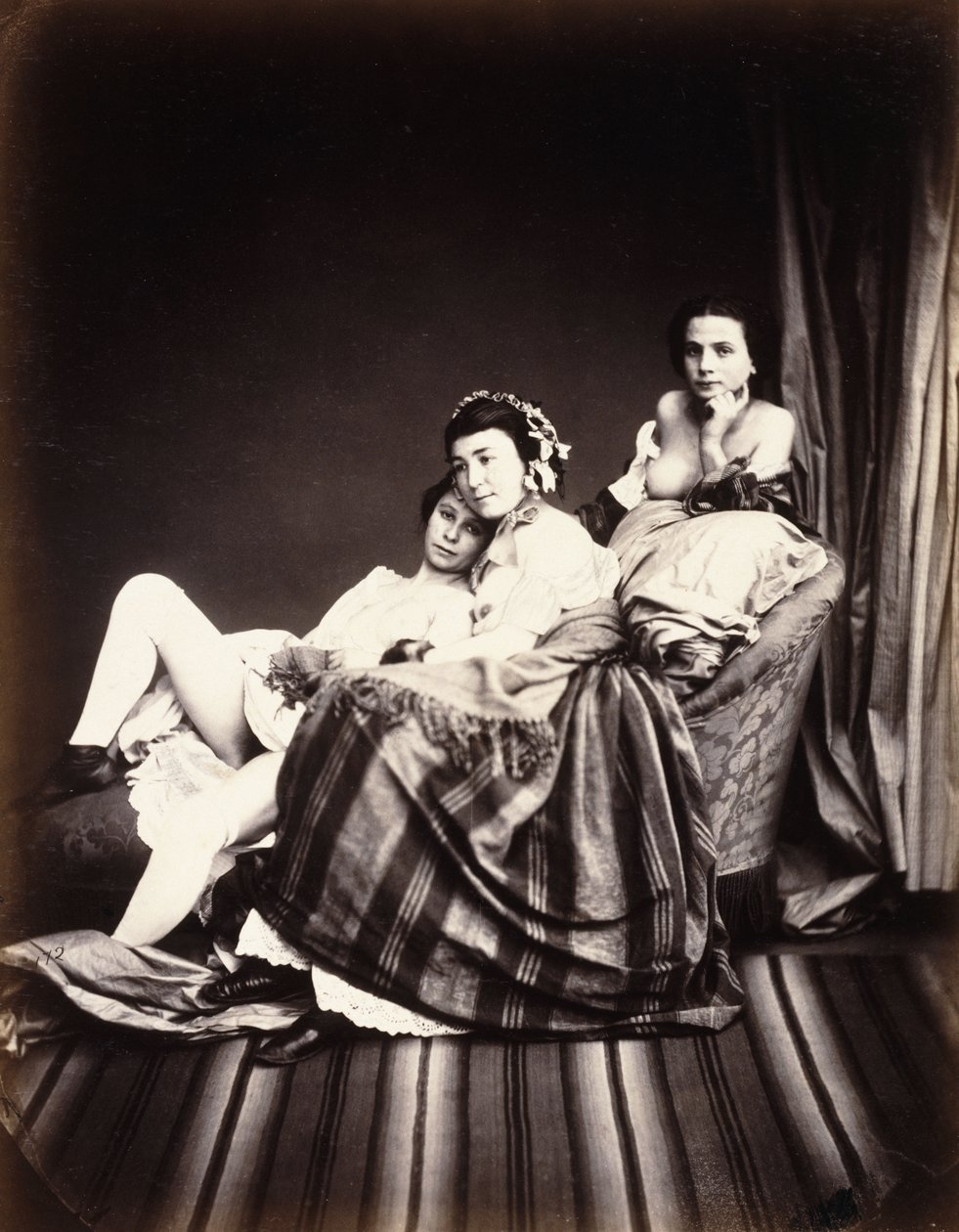 Drei nackte Frauen auf einer Chaiselongue, ca. 1850 von Auguste Belloc