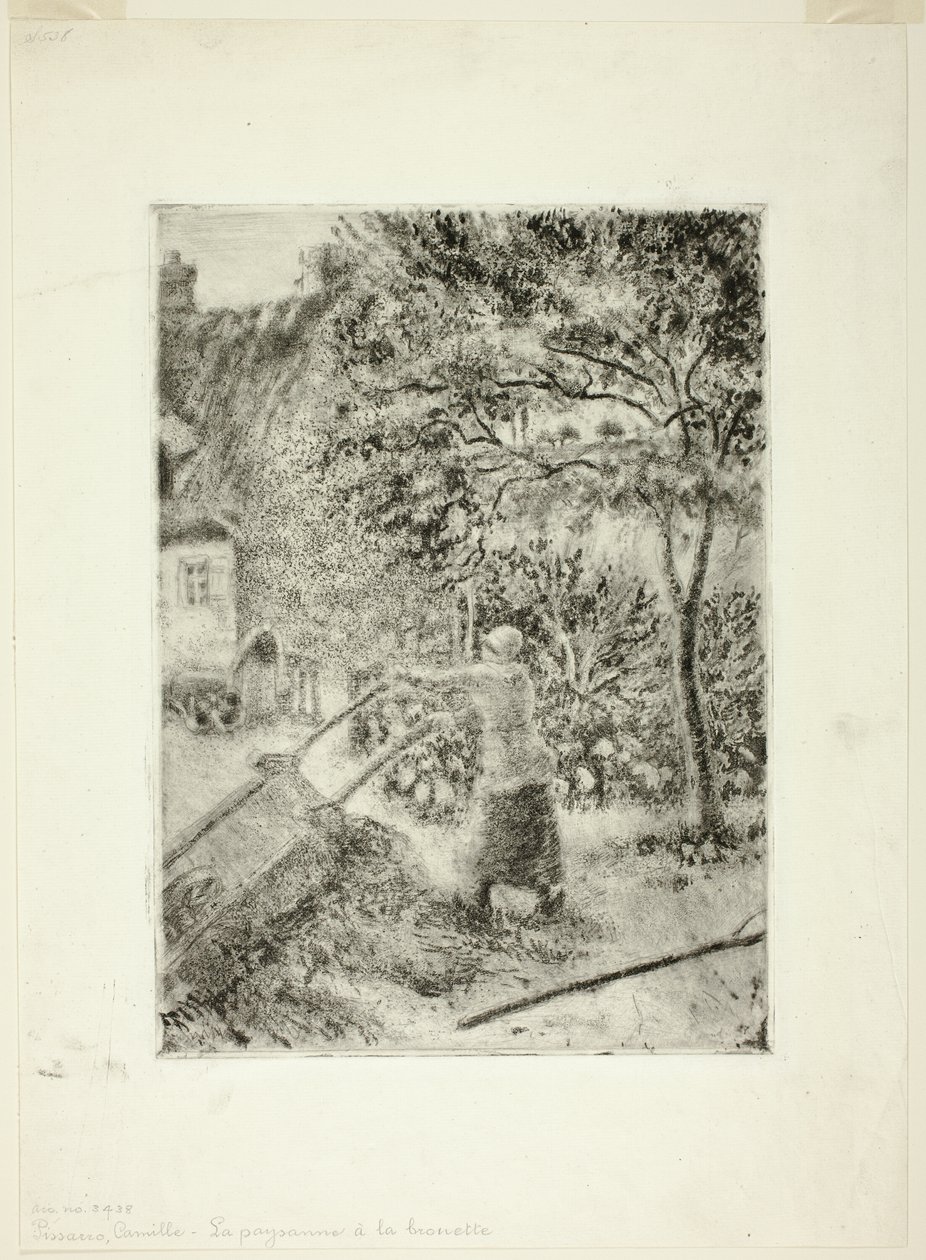 Frau leert eine Schubkarre von Camille Pissarro