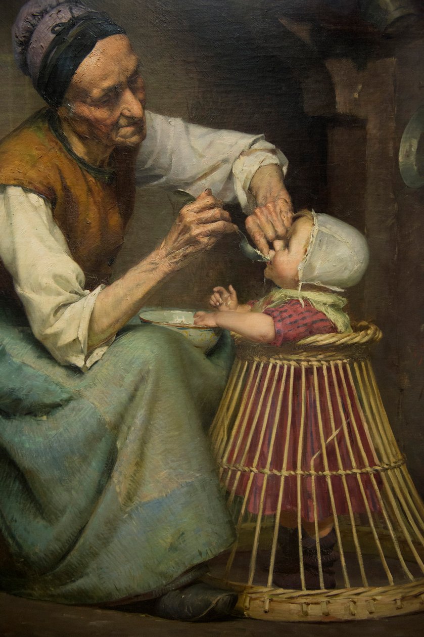 Eine alte Frau füttert ihre Enkelin in einem Weidenlaufstall von Edouard Jerome Paupion