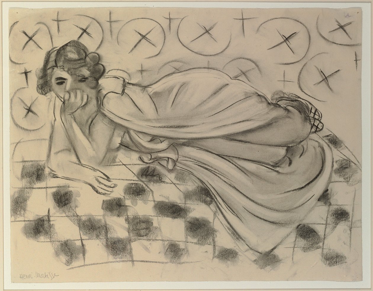 Bedeckte Figur auf einem schwarz karierten Sofa liegend von Henri Matisse