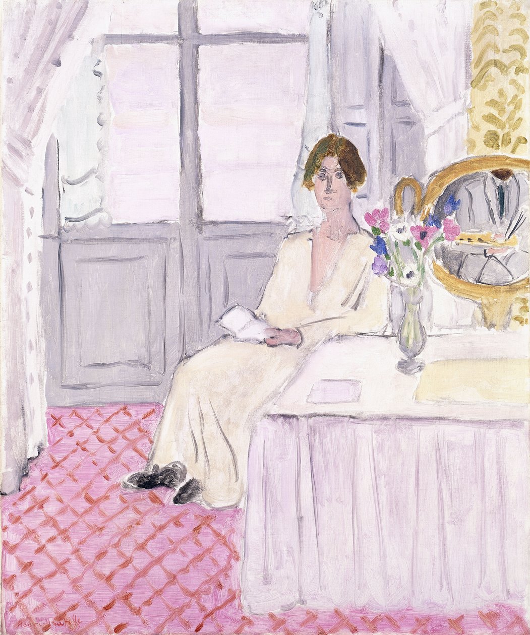 Frau liest vor einem Tisch und Blumenstrauß, Nizza von Henri Matisse
