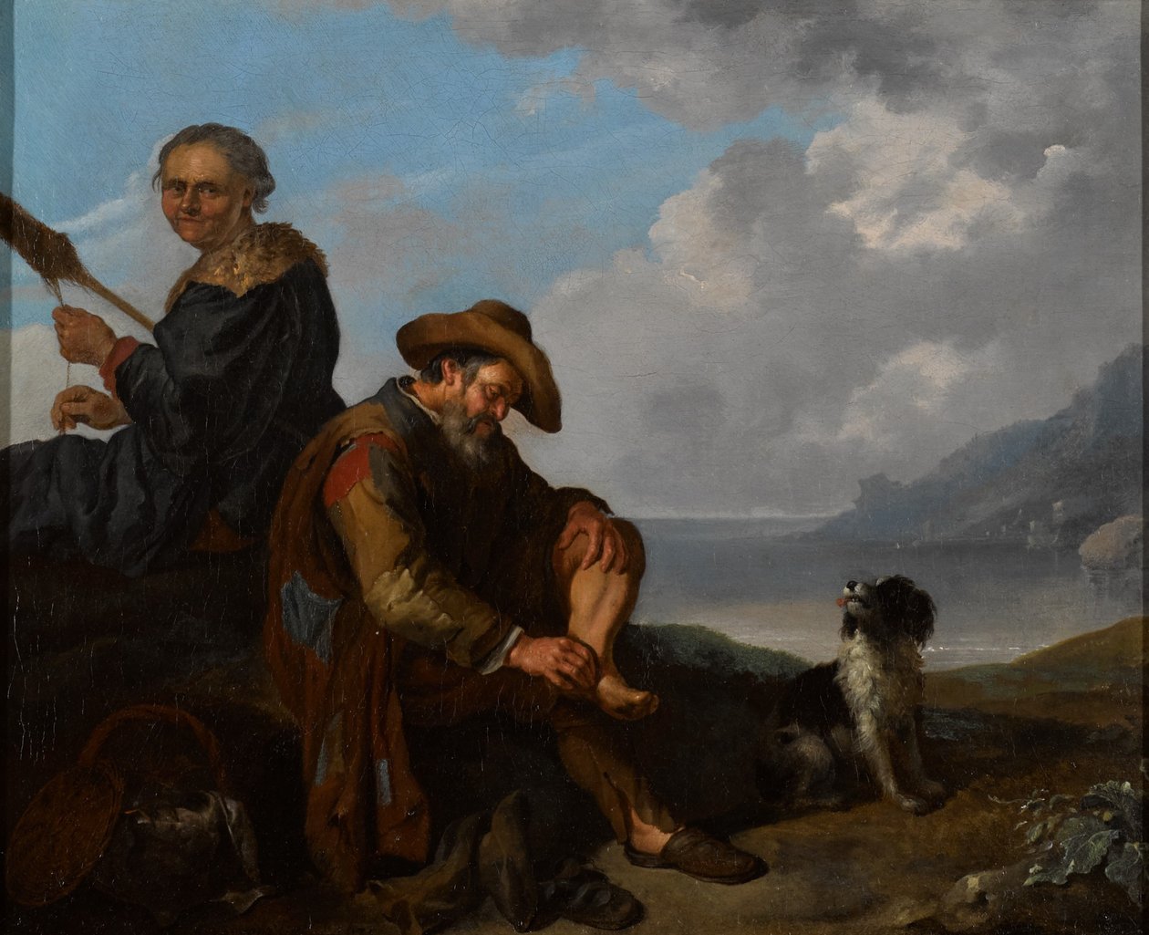 Eine südliche Küstenlandschaft mit einem Paar und einem Hund von Jacob Toorenvliet