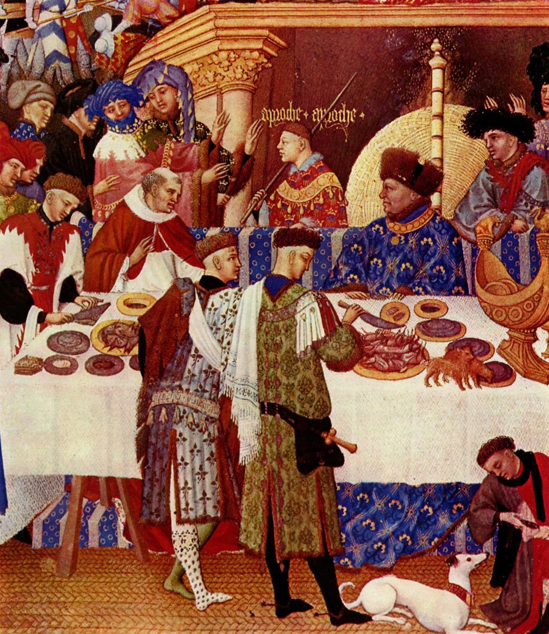 Der Herzog von Berry, sitzend unten rechts, mit dem Rücken zum Feuer, ist in Blau gekleidet und trägt eine Pelzmütze. Er lädt seine Leute und Verwandten ein, sich ihm zu nähern. Hinter ihm steht die Inschrift „Approche Approche“. Mehrere Vertraute des Herz von Limbourg Brothers