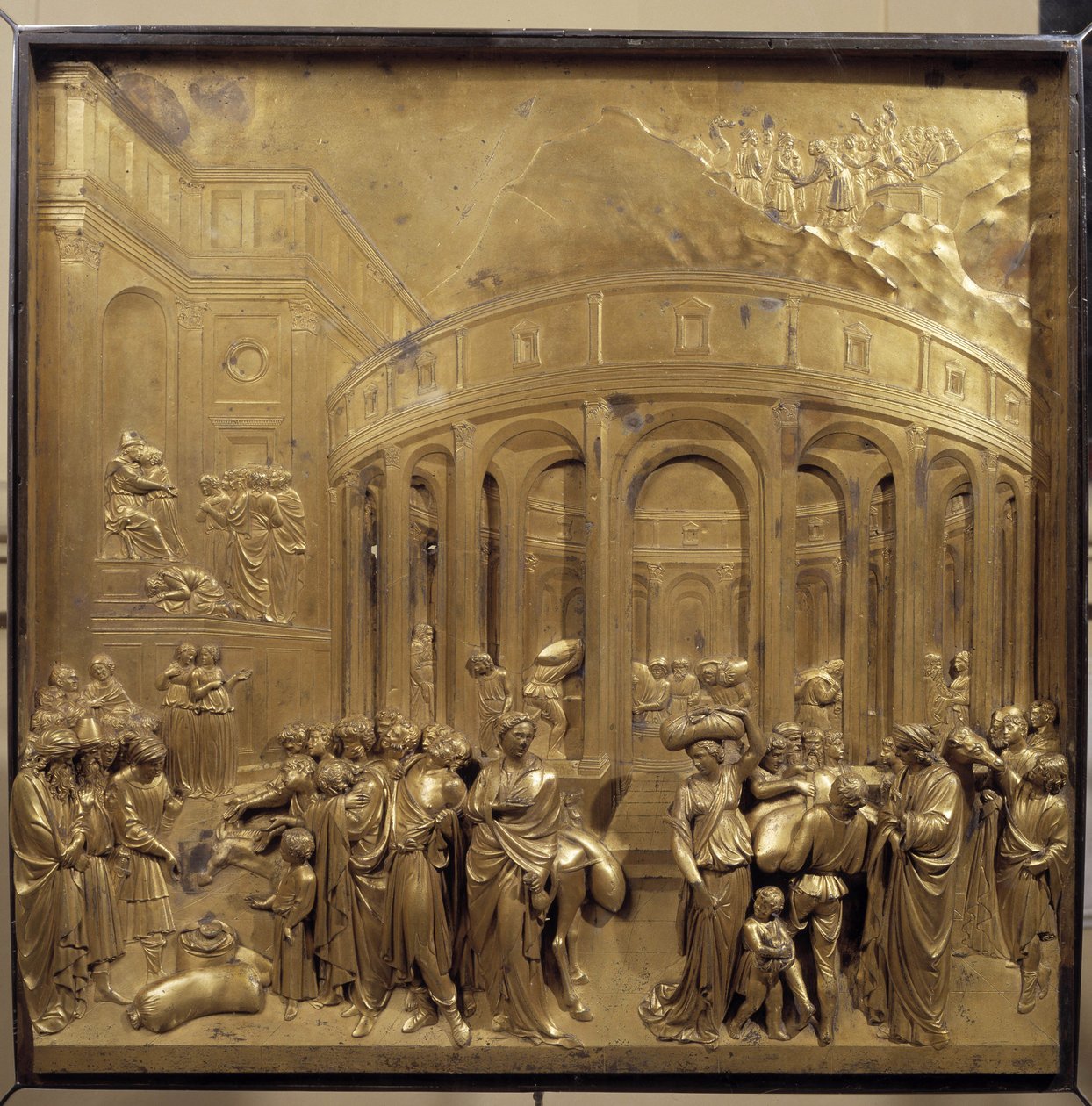 Geschichte des Lebens von Joseph. Die Weizenernte: Die Bauern bringen die Getreidesäcke. Originaltafel der Paradiespforte von Lorenzo Ghiberti