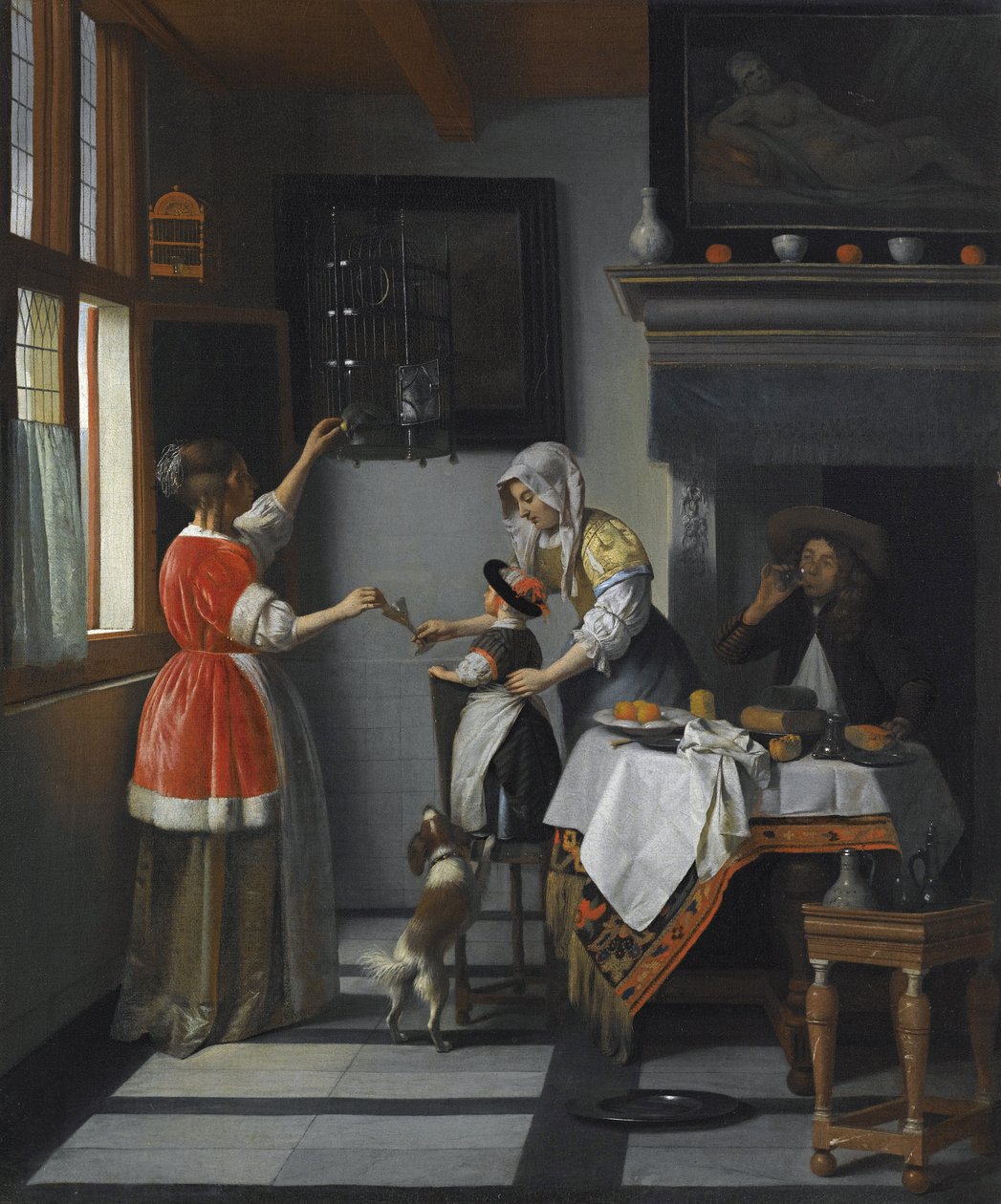 Interieur mit einem Kind, das einen Papagei füttert von Pieter de Hooch