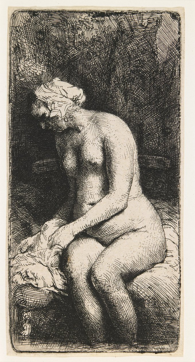 Frau, die ihre Füße an einem Bach badet von Rembrandt van Rijn
