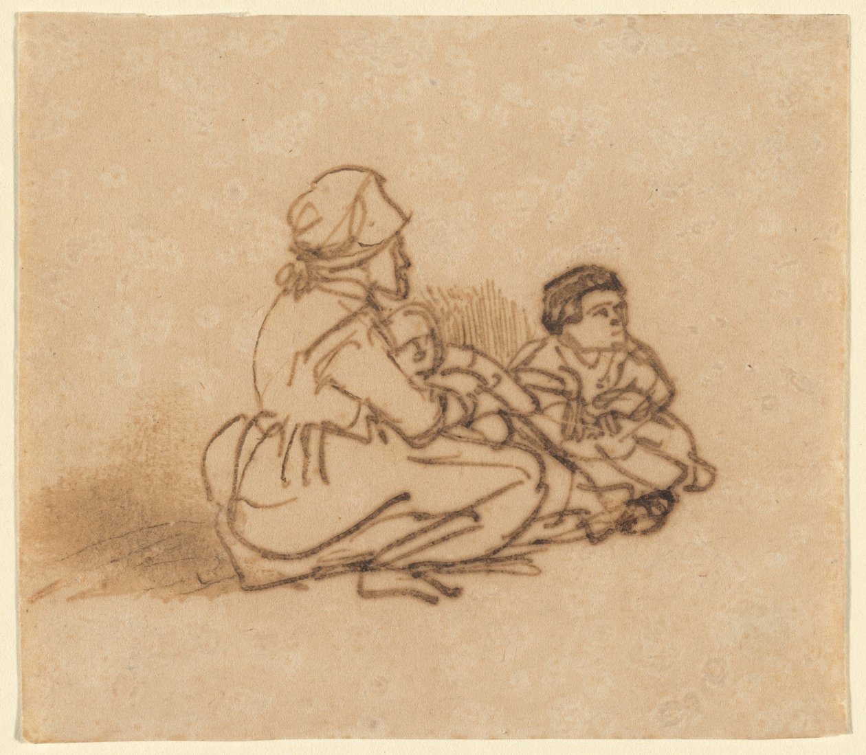 Frau sitzt auf dem Boden mit zwei Kindern von Rembrandt van Rijn