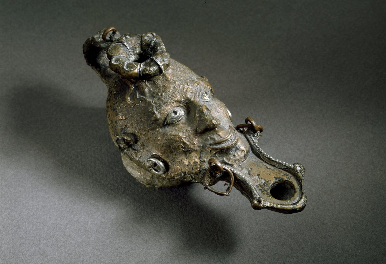Römische Kunst: Bronzeölleuchte in Form eines Gesichts von Roman