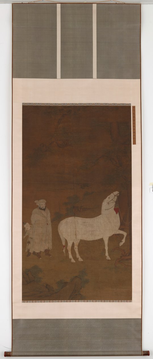 Zentralasiatischer Bräutigam, der ein Pferd weidet von Unbekannt