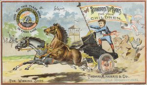 Junge beim Wagenrennen mit Stiefel von American School