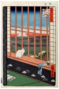 Eine Katze sitzt auf dem Fenstersitz