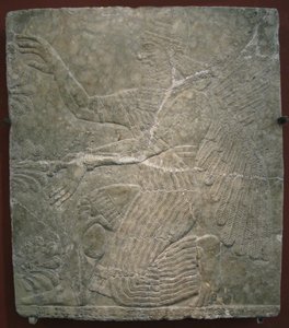 Geflügelte Gottheit am heiligen Baum. Relief aus dem Palast von Ashurnasirpal II. in Kalhu, Nimrud von Assyrian