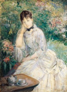 Junge Frau auf einem Sofa sitzend von Berthe Morisot