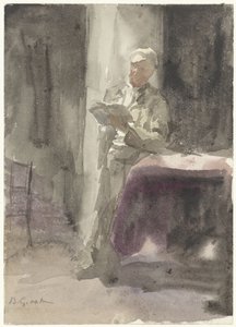 Mann mit einem Buch, stehend an einem Tisch und Fenster