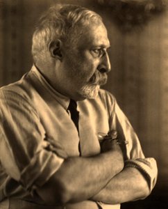 Profilporträt des Malers Arturo Rietti mit verschränkten Armen von Carlo Wulz
