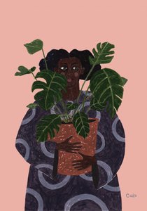 Frau hält Monstera-Pflanze
