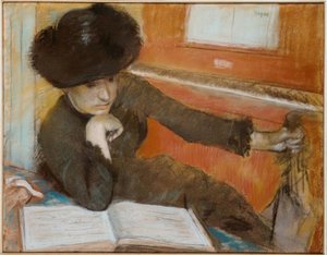 Frau sitzt vor einem Klavier von Edgar Degas