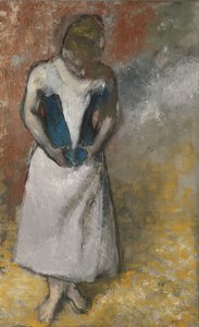 Frau steht von vorne und hält ihr Korsett, ca. 1883 von Edgar Degas