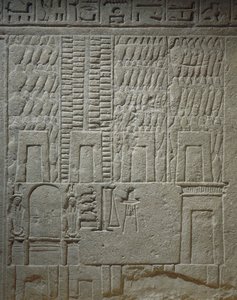 Wandrelief, das ein Lagerhaus darstellt (Detail der Waagen für das Wiegen von Waren)
