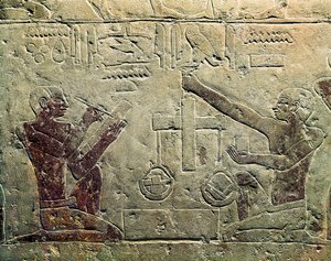 Basrelief, das einen Händler und einen Kunden darstellt: eine der Figuren benutzt eine Waage, während die andere Notizen macht, ca. 2465-2323 v. Chr.