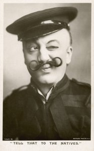 Frau in Uniform und mit Schnurrbart von English Photographer