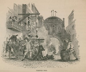 Eine Menschenmenge entzündet ein Lagerfeuer vor Temple Bar von English School