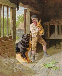 Junge mit einem Hund und einem Kaninchen auf einem Bauernhof