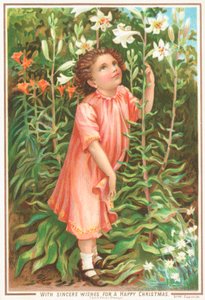 Mädchen riecht an Lilien im Garten von English School