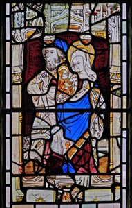 Fenster Ew, Darstellung von St. Anna, Joachim, der Jungfrau Maria und dem Christkind