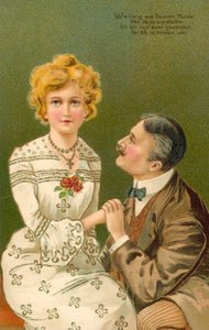 Mann hält die Hand einer jungen Frau von European School