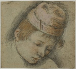 Kopf eines Jugendlichen mit rosa Mütze