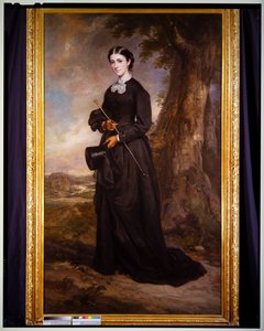 Porträt einer Dame in einem schwarzen Reitkleid, stehend in einer Landschaft von Francis Grant