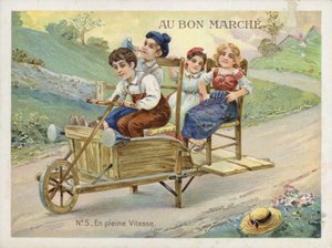Kinder spielen auf umgebauter Schubkarre von French School