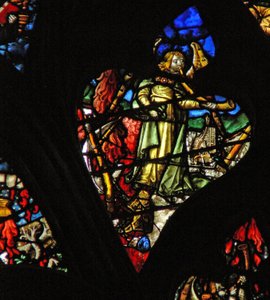 Das westliche Rosenfenster zeigt eine Szene aus dem Buch der Offenbarung: zweite Trompete; ein brennender Berg stürzt ins Meer (8:8-9). von French School