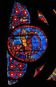 Fenster w115, ein geflügeltes Tier darstellend