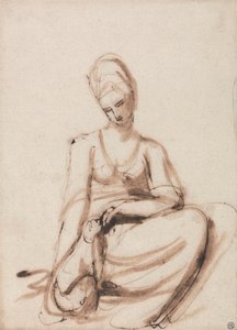 Sitzende Frau, die ein Tier füttert