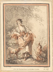 Frau füttert Hühner