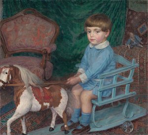 Kind mit einem Pferdespielzeug, um 1925