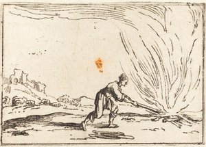 Mann bei einem Feuer