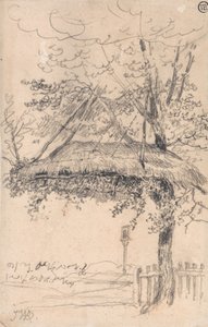 Ein strohgedeckter Unterstand, der an einem Baum hängt
