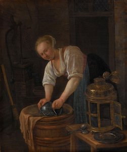 Frau beim Scheuern von Metallwaren