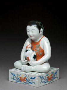 Junge mit einem Hund auf einem quadratischen Shogi-Tisch sitzend, Kakiemon verwandte Ware, Japanisch, 1680-1700 (Irdenware mit blauem Unterglasur)