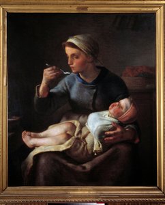 Frau füttert ihr Kind