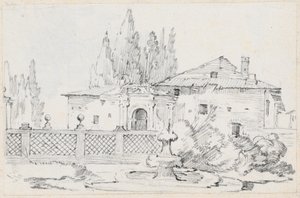 Haus und Bäume hinter einer Gartenmauer
