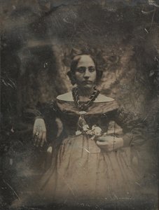 Junge Frau, die eine Blume hält von Joseph Philibert Girault De Prangey