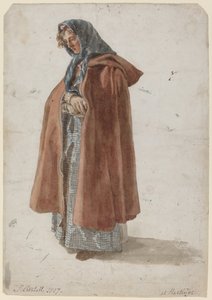 Junge Frau mit Kopftuch und Mantel in Hastings