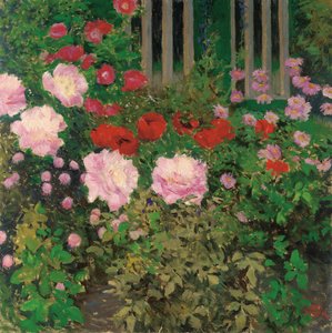 Blühende Blumen am Gartenzaun